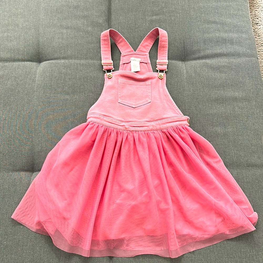 Jeans and tutu pinafore.